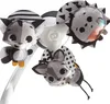 A close-up view of a baby mobile with stuffed animal toys. Voir les images du produit