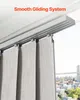 Close-up of a window with vertical blinds and a sliding track system, with a city view in the background. Produktbild-Vorschau