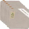 A stack of beige felt placemats with a tag and a diagonal banner. Produktbild-Vorschau