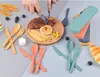 A flat lay of cutlery sets and food items. Produktbild-Vorschau