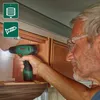 A man is using a Bosch cordless drill to screw something into a wooden cabinet. Produktbild-Vorschau