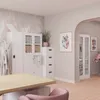 An office or medical room setting with furniture and artwork. Náhled obrázku produktu