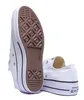 A pair of white Converse platform sneakers shown from a low angle, with one shoe's sole prominently displayed. Voir les images du produit