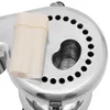 A close-up view of a juicer's internal mechanism and a plastic pusher. Náhled obrázku produktu