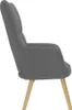 A side view of a dark gray fabric armchair with wooden legs. Anteprima dell’immagine prodotto