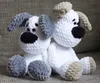Two crocheted dogs sitting on a textured surface. Náhľad obrázku produktu