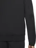 A close-up shot of a black Nike Sportswear Tech Fleece hoodie. Náhled obrázku produktu