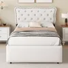 A bedroom scene with a white upholstered bed as the main focus. Podgląd zdjęcia produktu