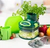 A kitchen gadget for preparing vegetables, along with some fresh produce and accessories. Anteprima dell’immagine prodotto