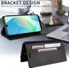 A desk setting with a laptop, phone, and other office items, showcasing a phone case with a bracket design and card slots. Produktbild-Vorschau