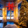 A festive Christmas scene with a red star lantern hanging in front of a window with a snowy landscape and a decorated Christmas tree. Náhled obrázku produktu