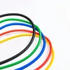 Several colored resistance bands are arranged in a circular pattern on a white background. Náhled obrázku produktu