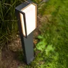 A modern outdoor LED path light is shown in a garden setting, surrounded by grass and foliage. Anteprima dell’immagine prodotto
