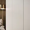 A close-up of a wardrobe with a lamp and decorative plants. Produktbild-Vorschau