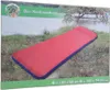 The image shows the packaging of an inflatable mattress with a picture of the mattress on it, set against a natural background. Produktbild-Vorschau
