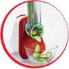 A close-up of an electric vegetable slicer with zucchini being sliced into a glass bowl. Náhled obrázku produktu