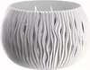 A white, decorative planter bowl with a wavy, cut-out design. Náhled obrázku produktu