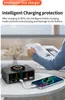 A person is reading a book while a charging hub and phone are on a table. Produktbild-Vorschau