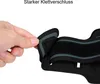 A hand is shown adjusting the velcro strap of a black sport armband. Produktbild-Vorschau