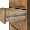 A close-up view of an open drawer in a wooden dresser, showing the drawer slides and the interior of the drawer. Podgląd zdjęcia produktu