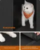 A white cat wearing an orange bandana is peeking out from a black cabinet. The image is divided into three sections, with the main section showing the cat and the other two sections showing close-ups of a scratching mat. Produktbild-Vorschau