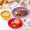 A table setting with various dishes and cutlery, suggesting a meal. Náhled obrázku produktu