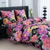 A bed with floral patterned bedding. Produktbild-Vorschau