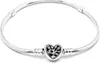 A silver Pandora bracelet with a heart-shaped clasp featuring a tree of life design. Anteprima dell’immagine prodotto