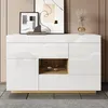A modern white sideboard with wood accents, displayed in a room setting with artwork and decorative items. Voir les images du produit