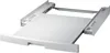A white pull-out drawer accessory for a washing machine, shown from a slight diagonal angle. Voir les images du produit