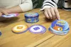 People playing a card game on a wooden table. Produktbild-Vorschau