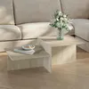A modern living room setting with a couch and a two-tiered coffee table. Náhled obrázku produktu