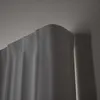 A close-up view of the top edge of a gray curtain and the ceiling. Podgląd zdjęcia produktu