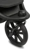 A close-up view of a black stroller wheel and part of the frame. Voir les images du produit