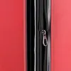A close-up view of a red suitcase zipper. Produktbild-Vorschau