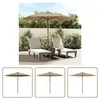 Two lounge chairs and a large umbrella are set up on a patio with a wooden fence and greenery in the background. Produktbild-Vorschau