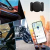 A collage of images showing a car interior, cyclists, a motorcyclist, and a hand holding a smartphone with a map application, alongside a black GPS tracker. Produktbild-Vorschau