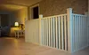 A white wooden railing in a hallway, with a living room visible in the background. Produktbild-Vorschau