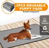 A dog is lying on a reusable puppy pad on a wooden floor, with marketing text and icons in the background. Produktbild-Vorschau