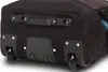 Close-up view of the bottom of a black rolling suitcase, showing the wheels and handle. Náhľad obrázku produktu