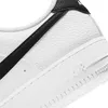 A close-up view of a white Nike sneaker with a black swoosh. Anteprima dell’immagine prodotto