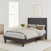 A bedroom scene with a bed, window, and a small cabinet. Produktbild-Vorschau