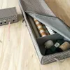 An open storage organizer for gift wrap and craft supplies, shown on a wooden surface. Anteprima dell’immagine prodotto