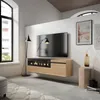 A modern living room with a wall-mounted TV stand featuring an electric fireplace, a large television, and decorative items. Produktbild-Vorschau
