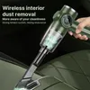 A hand holding a green handheld vacuum cleaner, cleaning the interior of a car. Produktbild-Vorschau