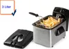 A stainless steel deep fryer with a basket of french fries inside, and a detached lid. Produktbild-Vorschau
