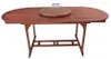 A wooden dining table with a lazy susan in the center and two glasses on it, isolated on a white background. Produktbild-Vorschau