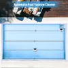 An aerial view of a swimming pool with a robotic pool cleaner demonstrating its cleaning path, with lounge chairs and a table visible on the wooden deck. Produktbild-Vorschau