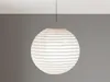 A white paper lantern hanging from a ceiling. Anteprima dell’immagine prodotto