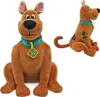 Two plush toys of the cartoon character Scooby-Doo are shown against a white background. The toy on the left is facing forward, and the toy on the right is in a side profile. Náhled obrázku produktu